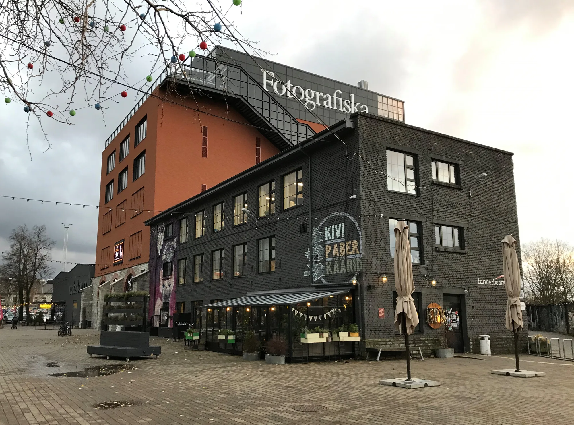 Exterior of Fotografiska Tallinn, the photography museum in a converted brick industrial building in Telliskivi, with rooftop signage
