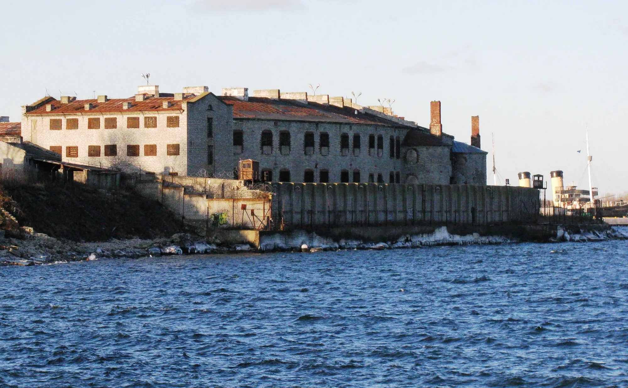 The long Patarei sea fortress and former prison on Tallinn's coast, seen from the water along its seawall